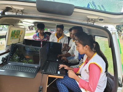 Students working in Project Surya Kiran Digital Literacy Van (PRNewsfoto/Edimpact)